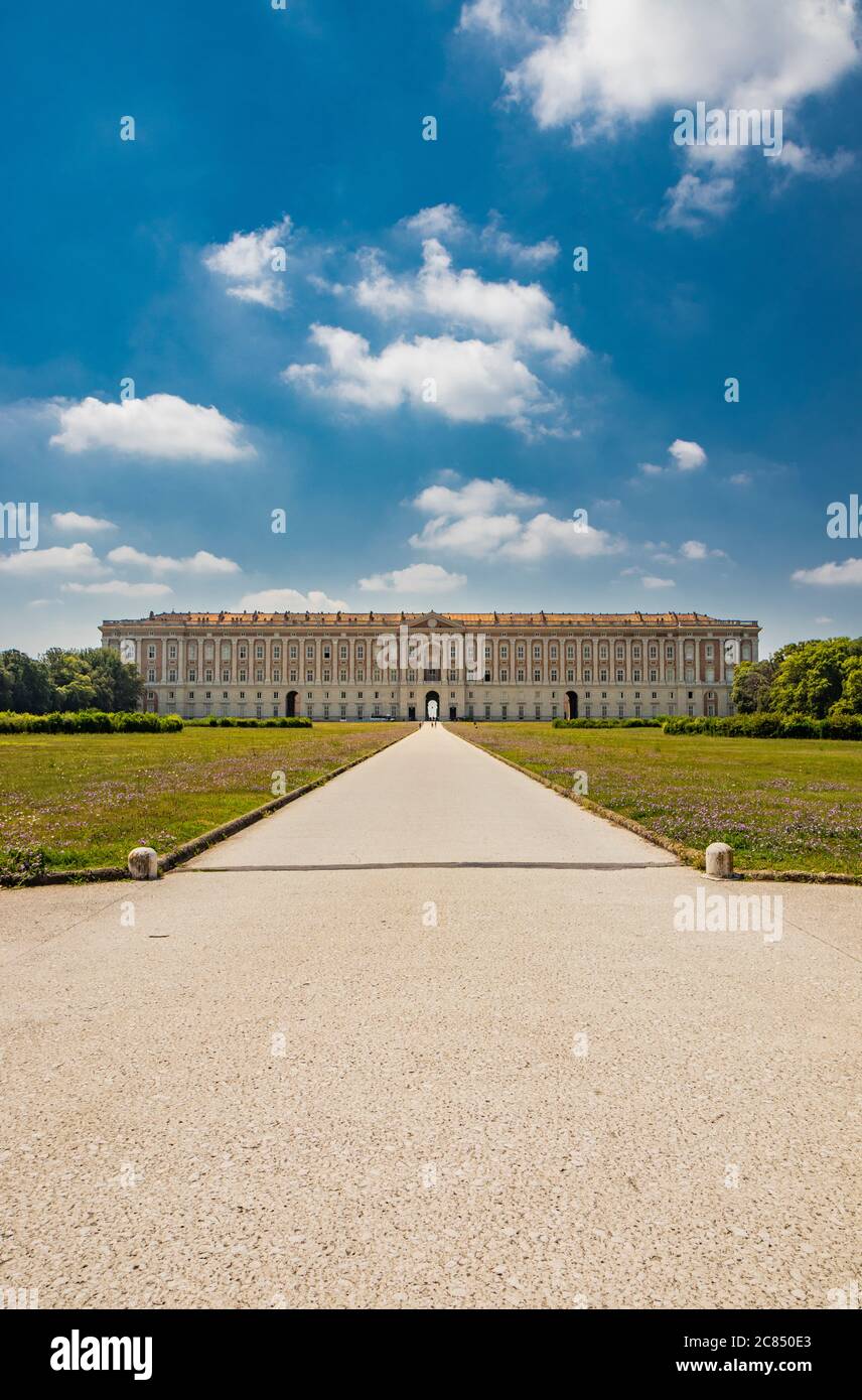 July 3, 2020 - Royal Palace of (Reggia di) Caserta - The facade of the majestic palace with the long avenue that leads to the large park. The trees an Stock Photo