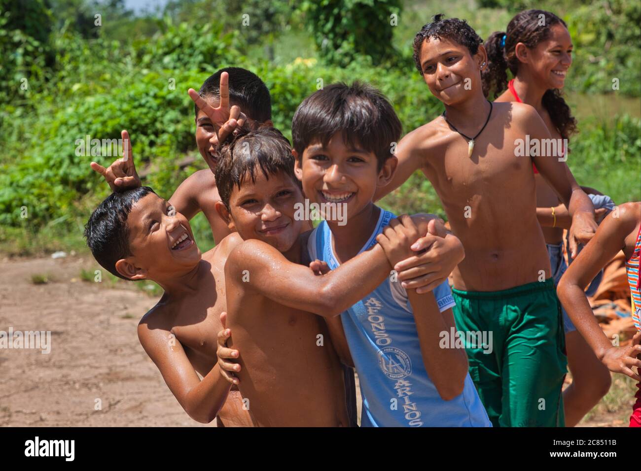 A group of five boys and a girl with the boys having fun and some looking at the camera in Macapa, Amapa State, Brazil Stock Photo
