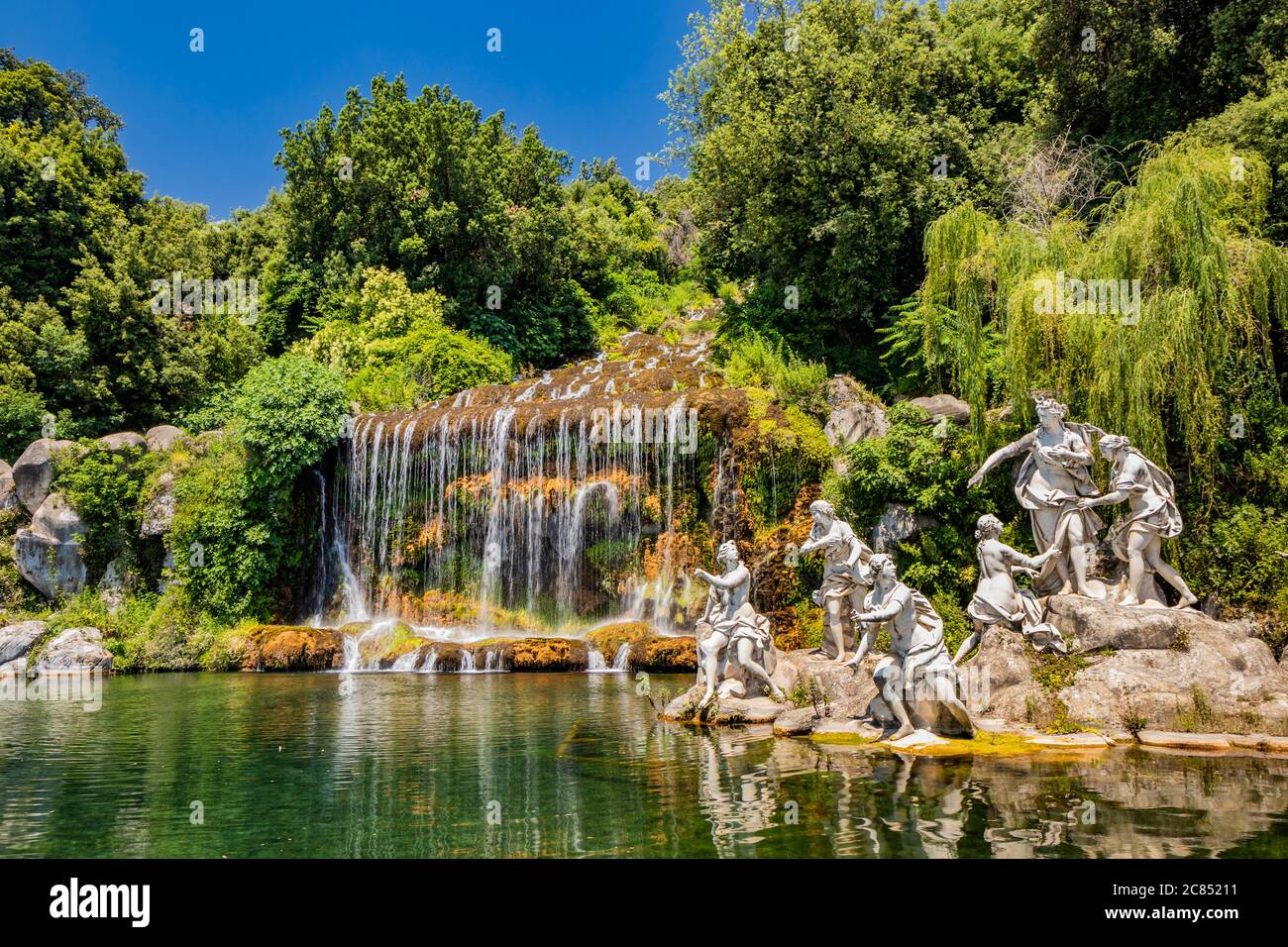 July 3, 2020 - Royal Palace of (Reggia di) Caserta - The large fountain with marble statues, waterfall and water features. The blue sky in summer. Tre Stock Photo
