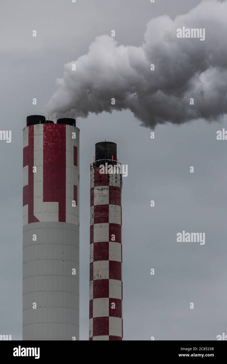 Industrial chimneys expelling gases into the atmosphere Stock Photo