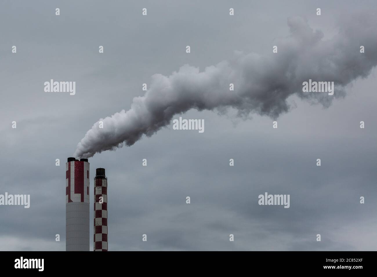 Industrial chimneys expelling gases into the atmosphere Stock Photo