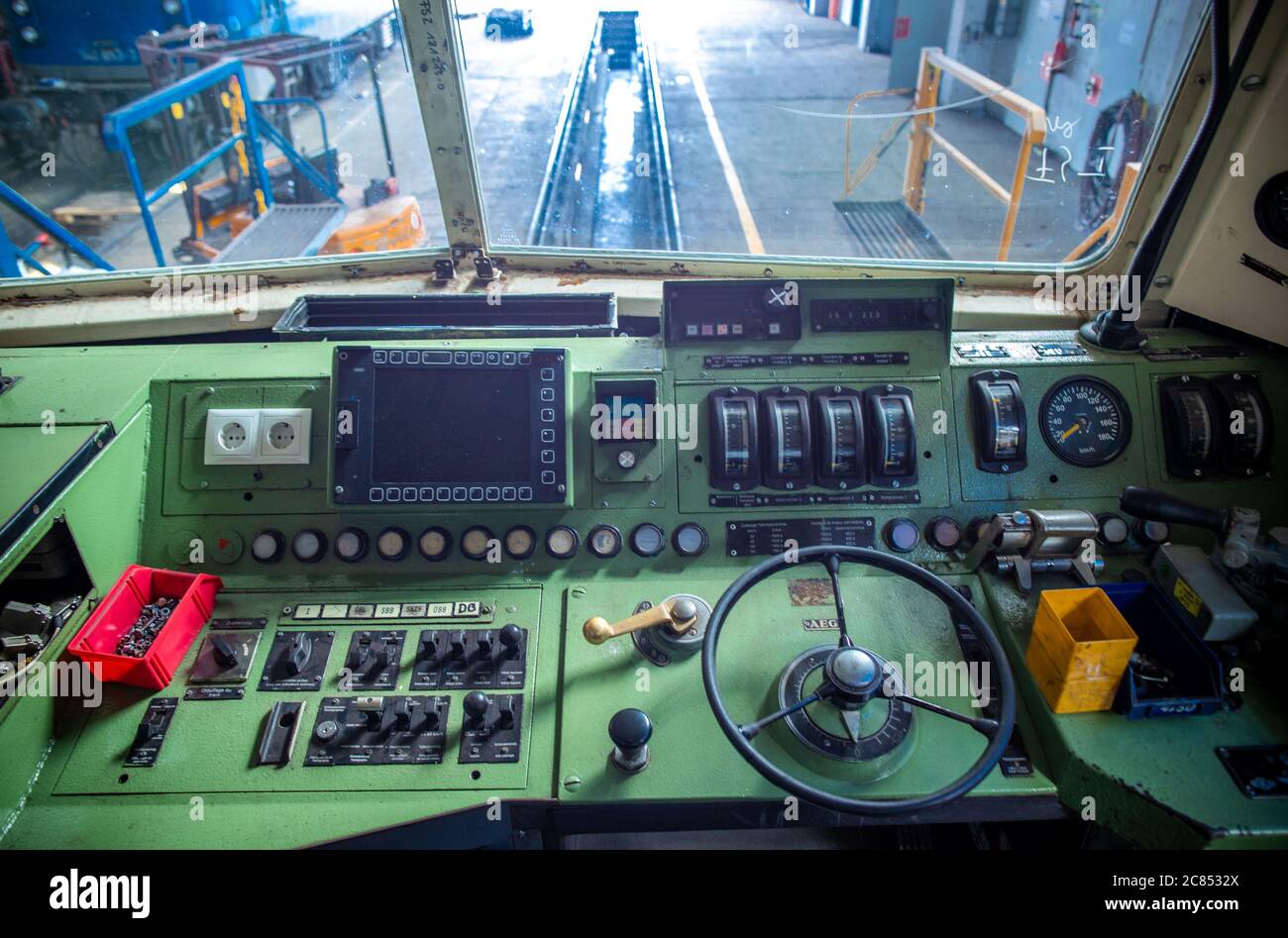 16 July 2020, Mecklenburg-Western Pomerania, Mukran: The driver's cab of the class 181 electric locomotive built in 1972 in the repair shop of Baltic Port Services GmbH (BPS). Several of the locomotives built from a small series at Krupp in Essen and AEG in Berlin, eight of the once 29 of these electric locomotives still exist today, are being repaired for the company Schlünß Eisenbahn Logistik (SEL) from near Neumünster in Schleswig-Holstein. In the workshop opened by the Deutsche Reichsbahn in 1986, rail vehicles coming from the railway ferry were re-gauged from the 1520 millimetre wide Russ Stock Photo