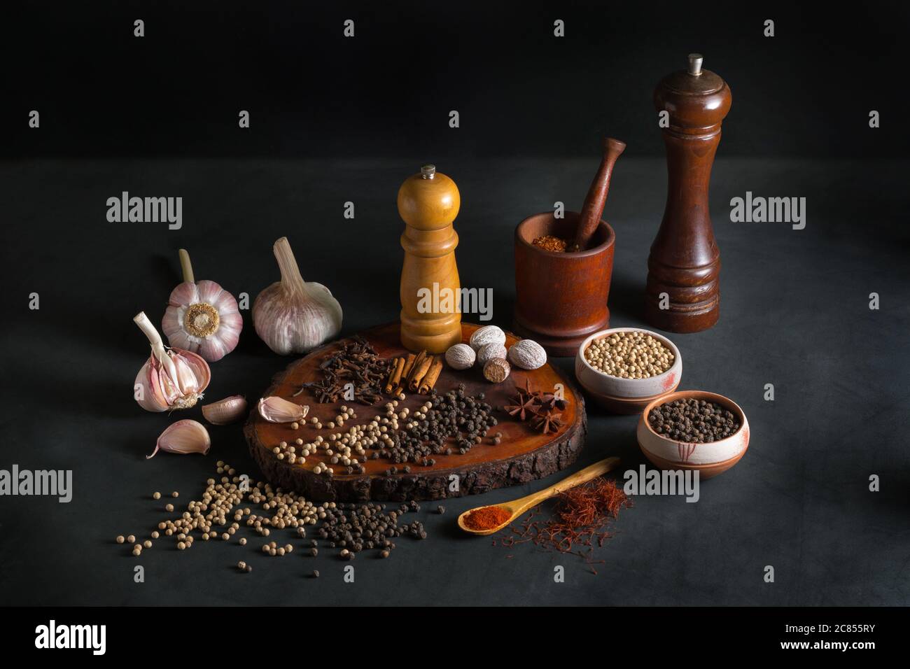 Still life with different kind of spices like pepper, nutmeg, garlic