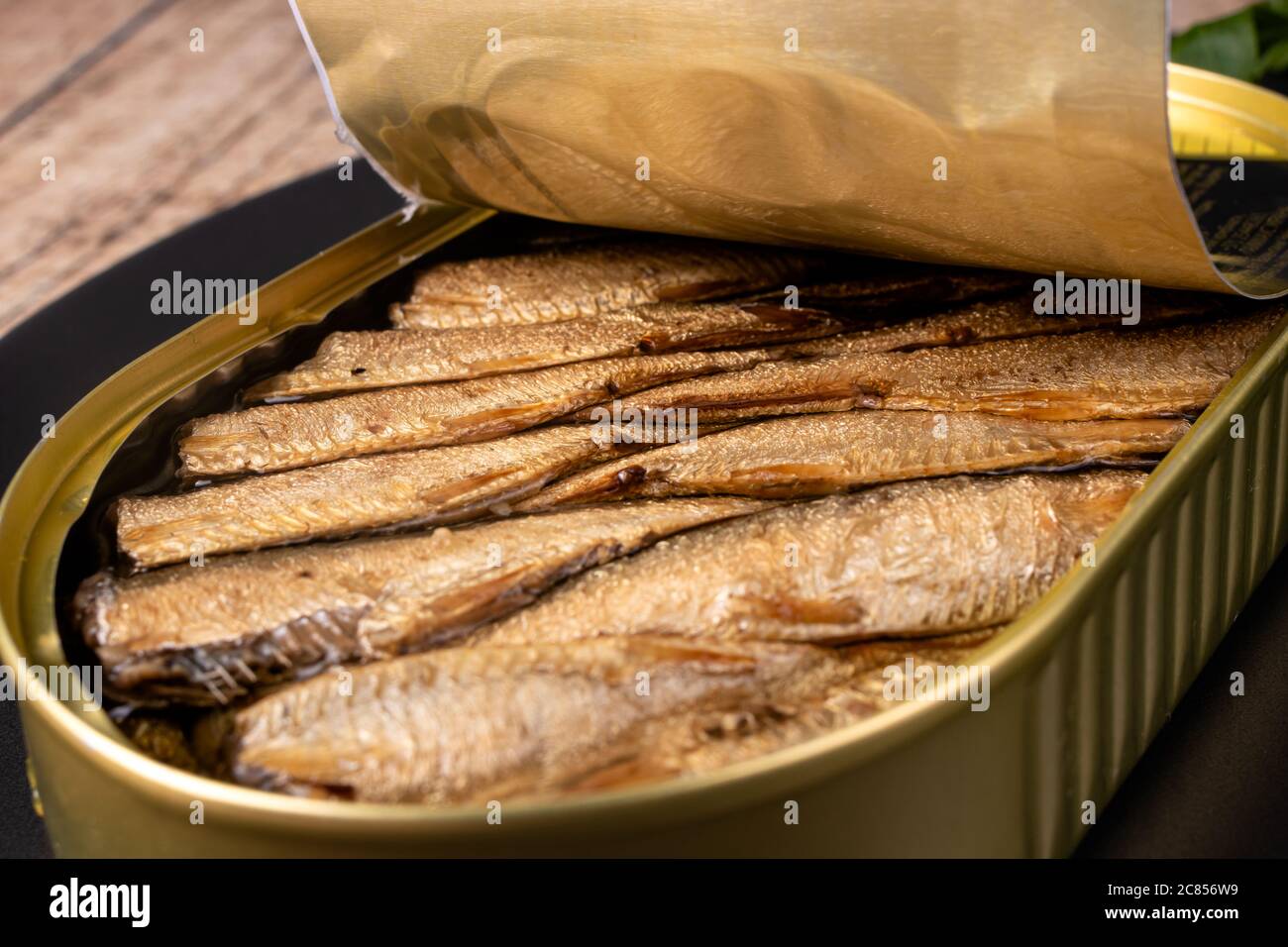 Canned fish - smoked sprats in oil. Conserve from herring, sprats and other small fish. Stock Photo