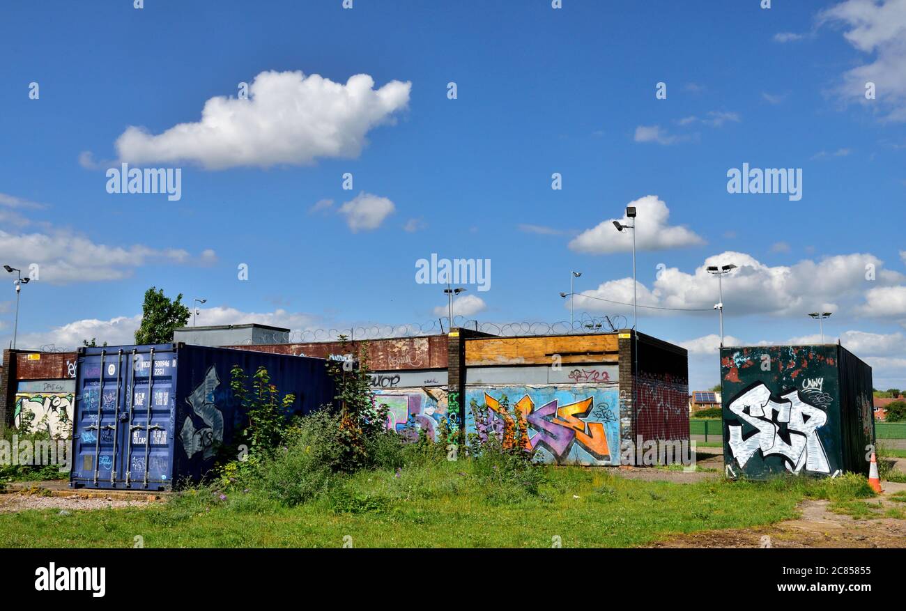 Derelict, abandoned buildings and shipping containers covered in graffiti Stock Photo