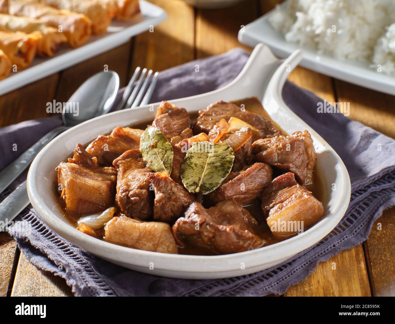 filipino pork adobo in bowl with bay leaves close up Stock Photo Alamy