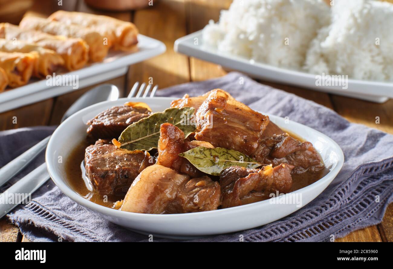 filipino pork adobo in bowl with rice in background Stock Photo Alamy