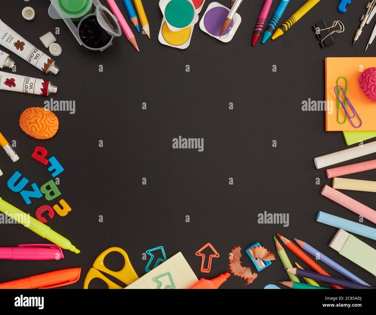 School supplies on blackboard Stock Photo