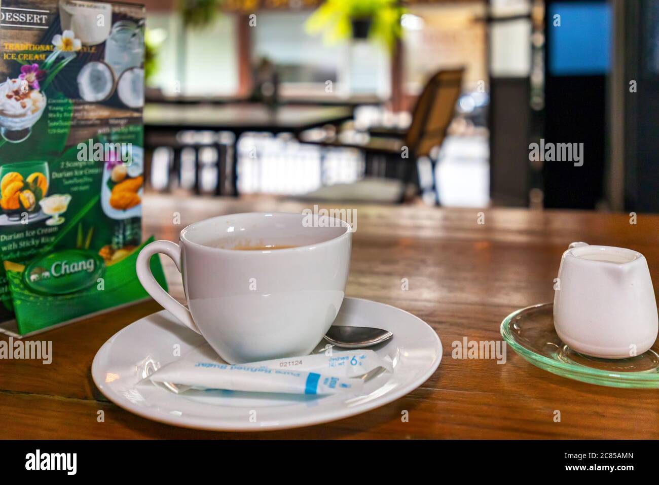 Coffee cup and menu in Thai restaurant during covid 19 pandemic, Bangkok, Thailand Stock Photo