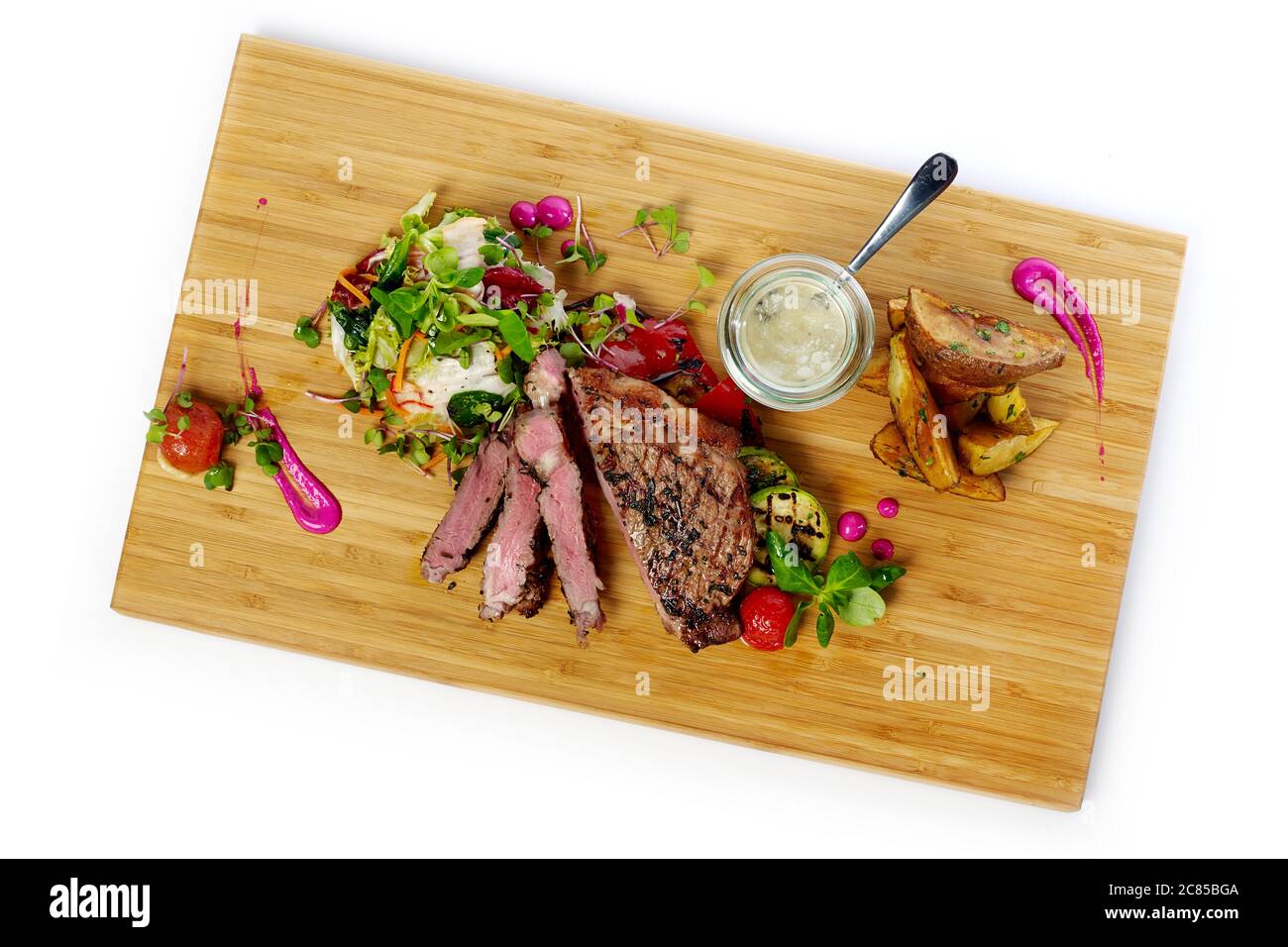 Grilled steak with potatoes and salad Stock Photo - Alamy