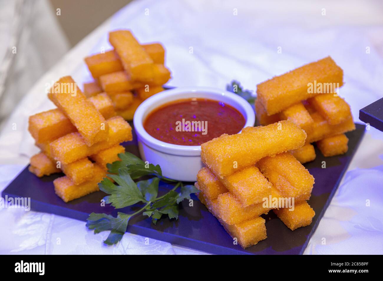 mozzarella sticks overflowing with red sauce Stock Photo Alamy