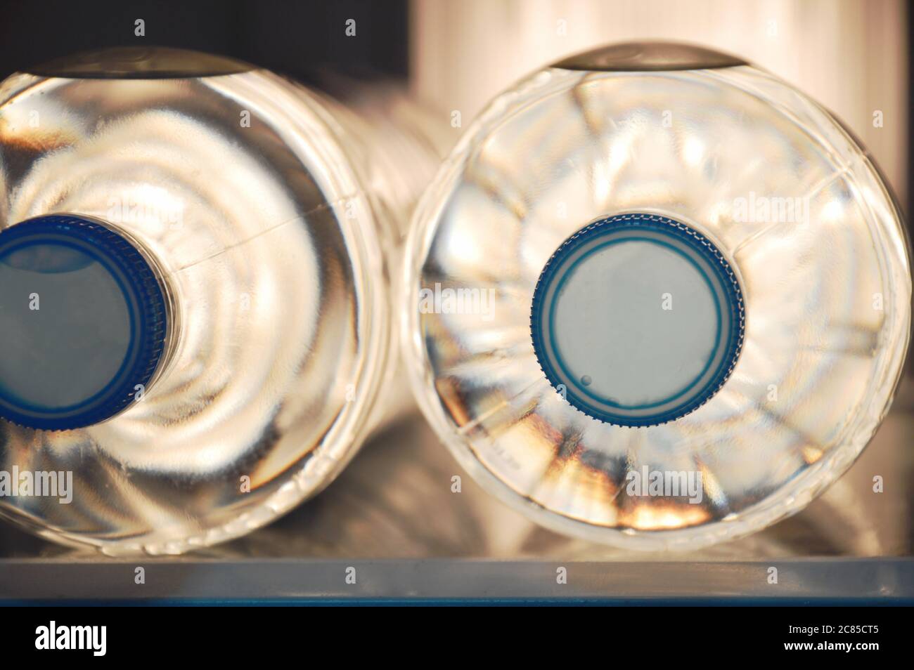 fresh water plastic bottle arranging in refrigerator Stock Photo Alamy