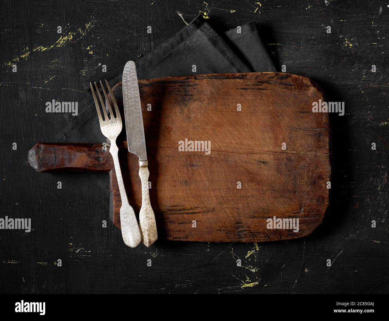 Fork, knife and cutting board Stock Photo