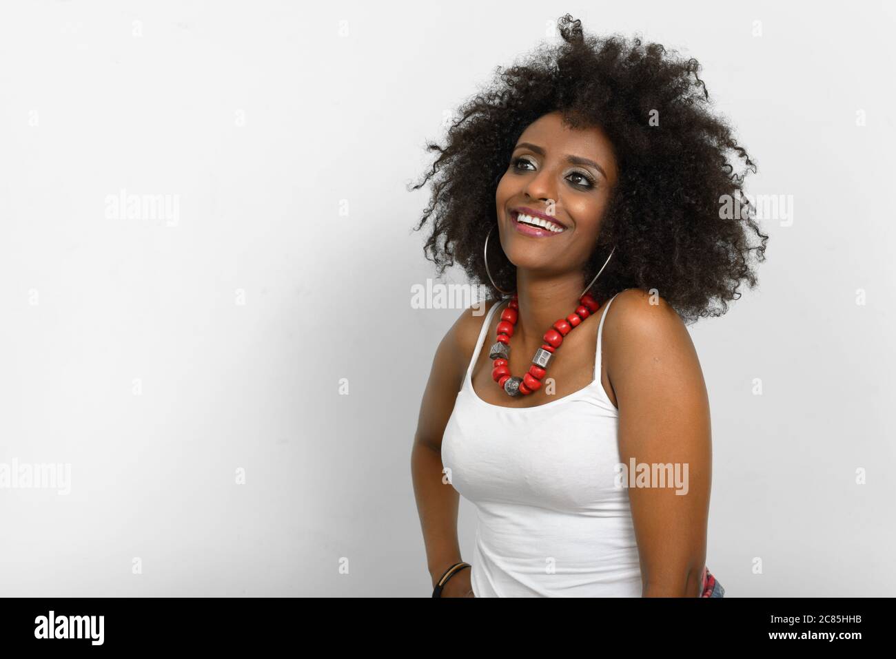 Portrait of young beautiful African woman with Afro hair Stock Photo ...