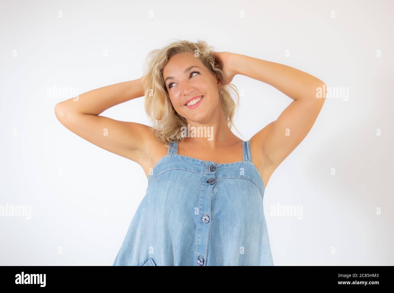 Woman blonde in blue dress hi-res stock photography and images - Alamy