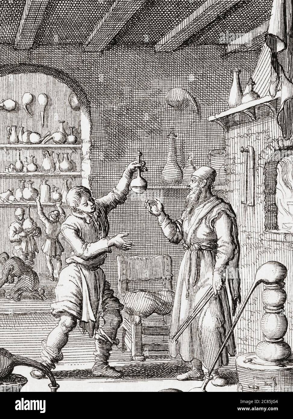 17th century chemists at work in their laboratory.  After a work by Dutch illustrator and engraver Jan Luyken. Stock Photo
