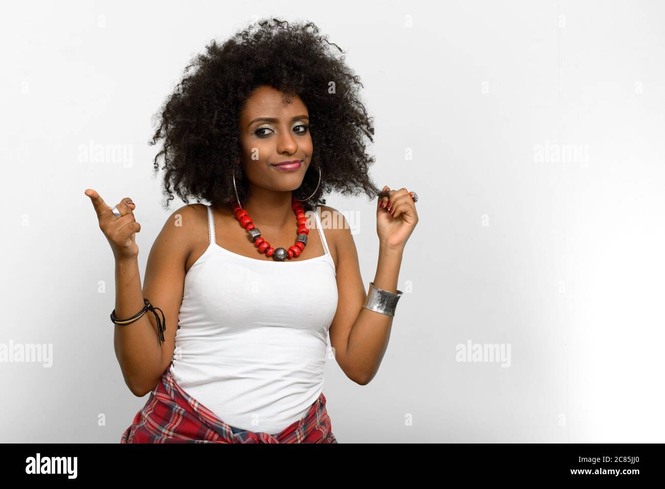 Portrait of young beautiful African woman with Afro hair Stock Photo ...