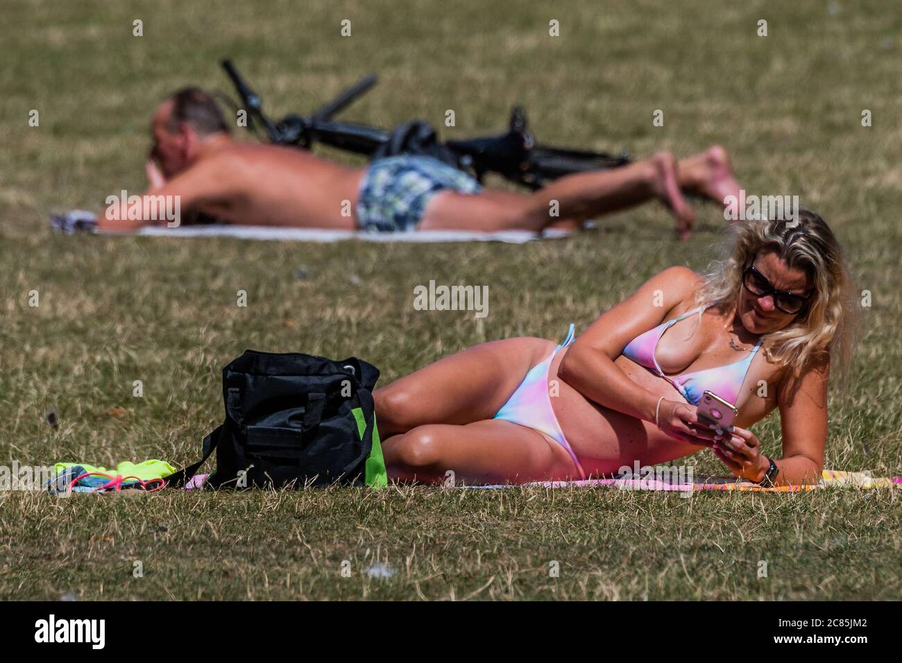 Bridget Malcolm rings in the New Year by stripping down to her bikini  bottoms 