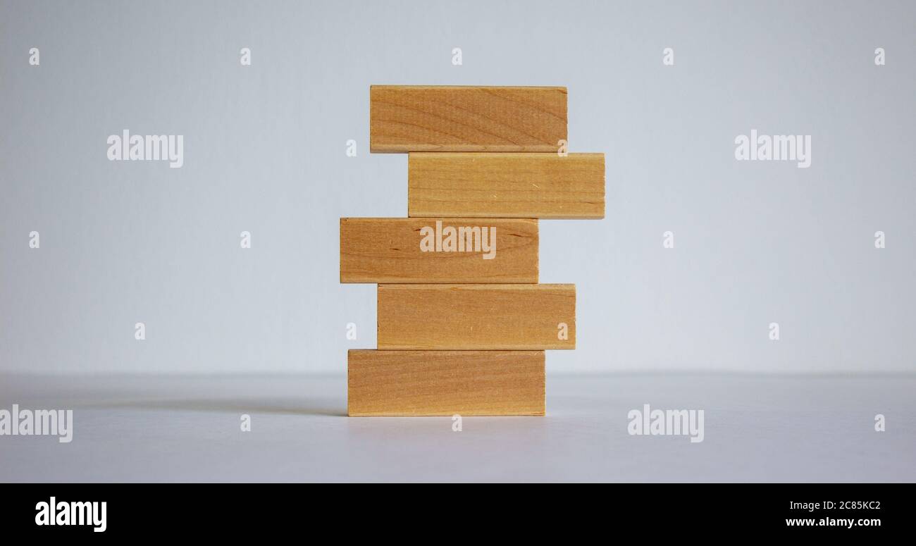 Concept of building success foundation. Stack of wooden blocks ...