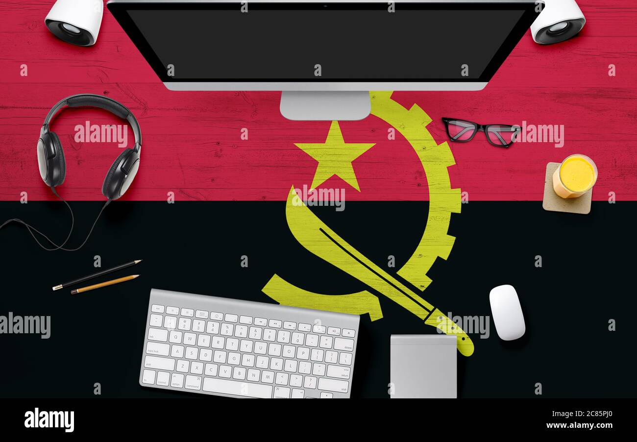 Angola flag background with headphone,computer keyboard and mouse on ...