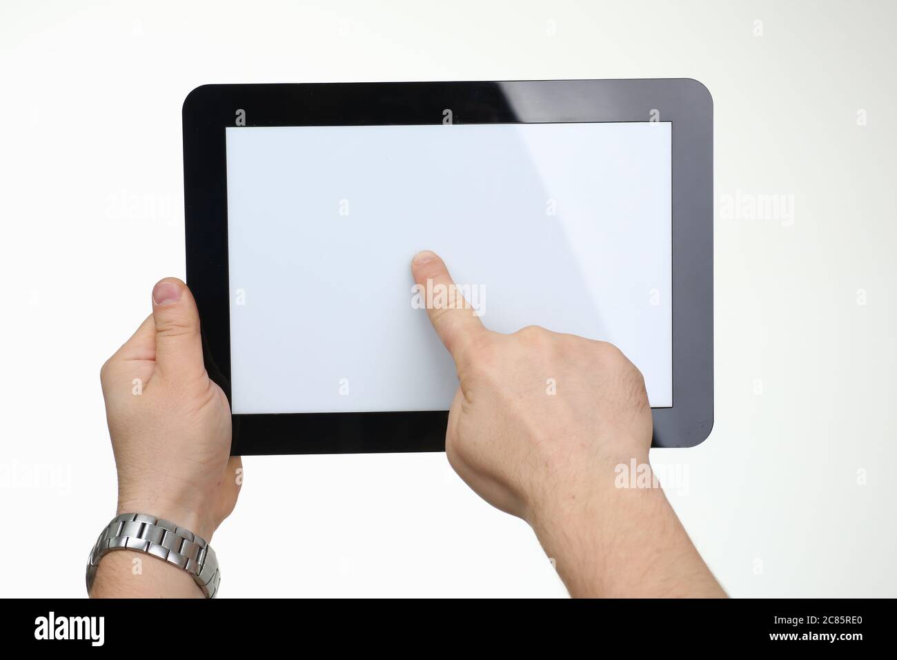 Focused photo on hand that pointing on screen Stock Photo