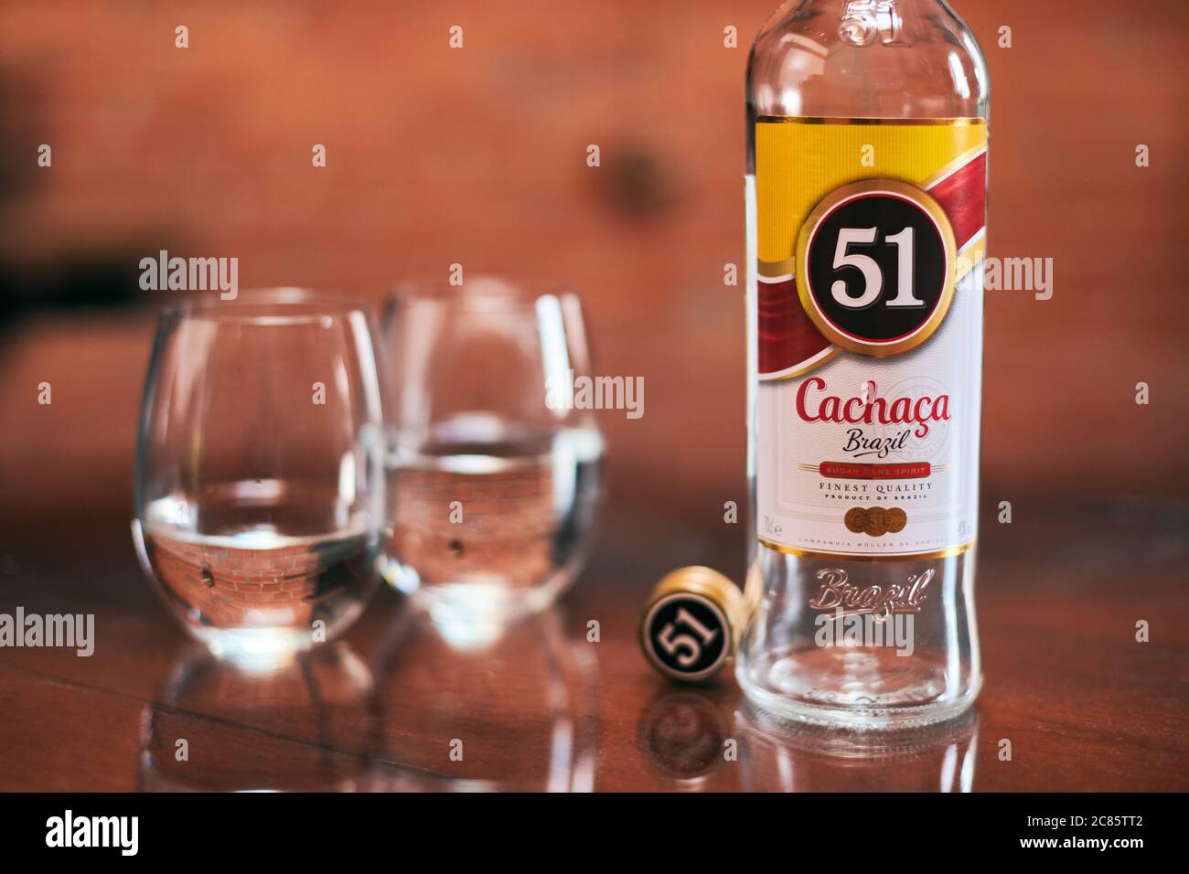 Moscow 23.11.2019 Cachaca 51 bottle with two glasses. Brazilian rum. Exotic Brazil strong