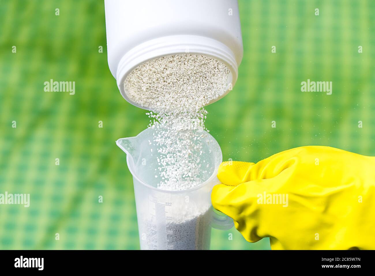 addition of chlorine powder for the pool to remove algae and disinfect