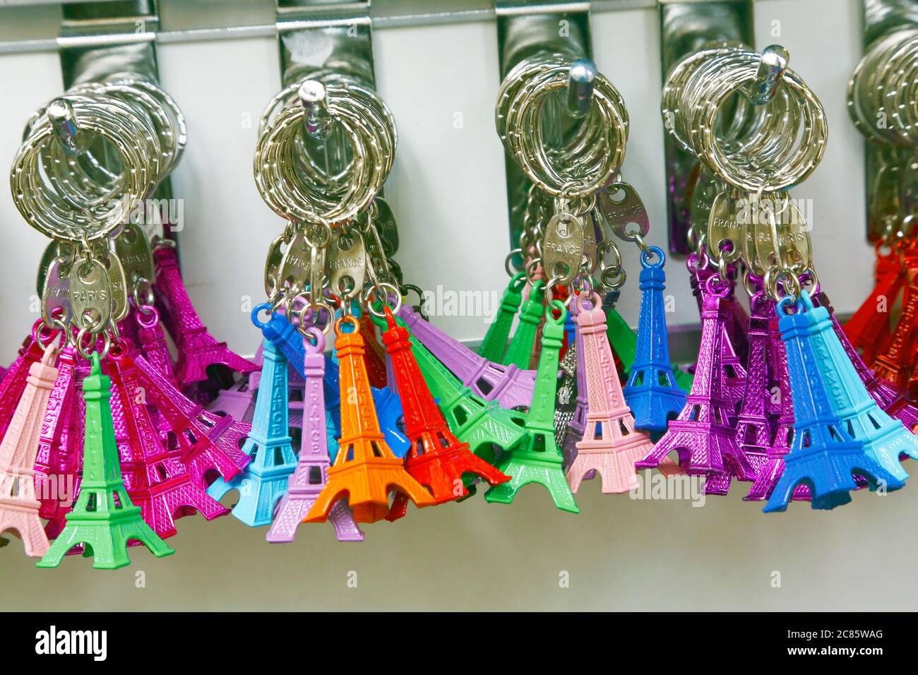 Multicolored key rings, souvenir of Tour Eiffel, on sale by a street vendor Stock Photo