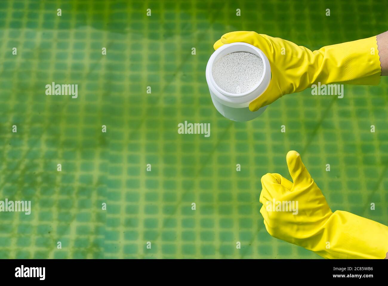 addition of chlorine powder for the pool to remove algae and disinfect