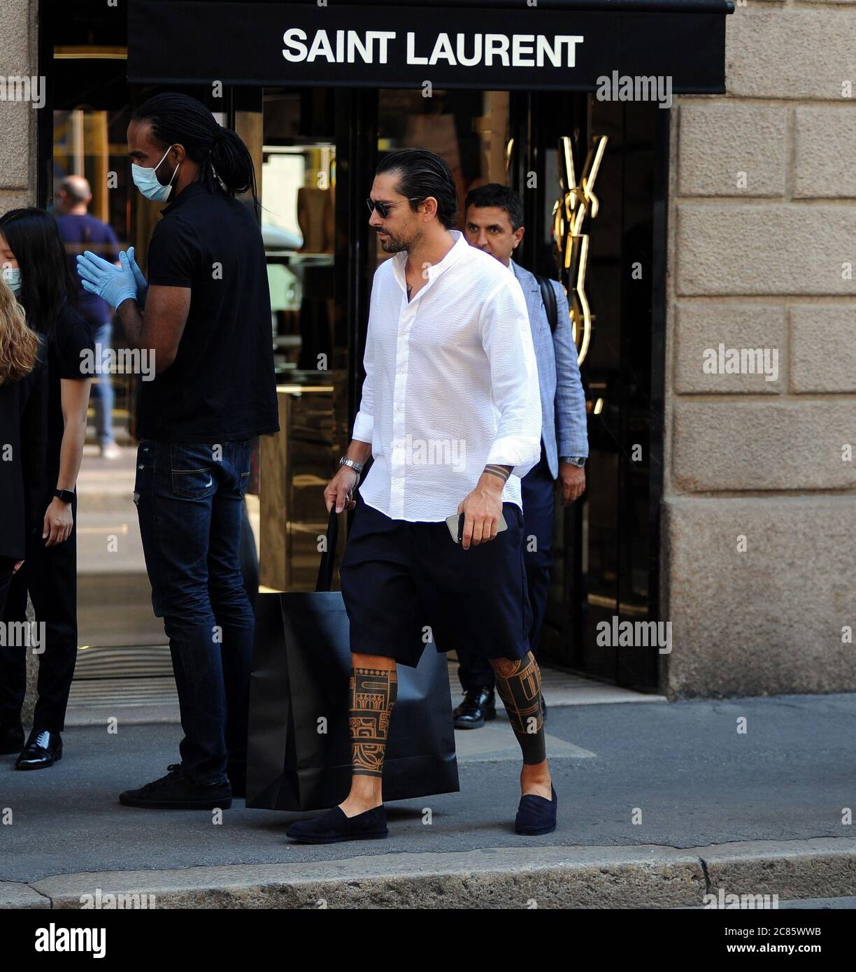 Milan, Marco Borriello shopping in the center Marco Borriello, recently  photographed together with Marica Pellegrinelli, ex-wife of Eros  Ramazzotti, arrives in the center for shopping. Enter the "SAINT LAURENT"  boutique in via