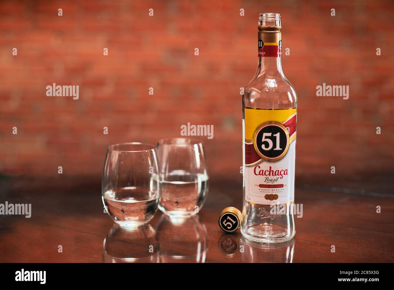 Moscow 23.11.2019 Cachaca 51 bottle with two glasses. Brazilian rum. Exotic Brazil strong