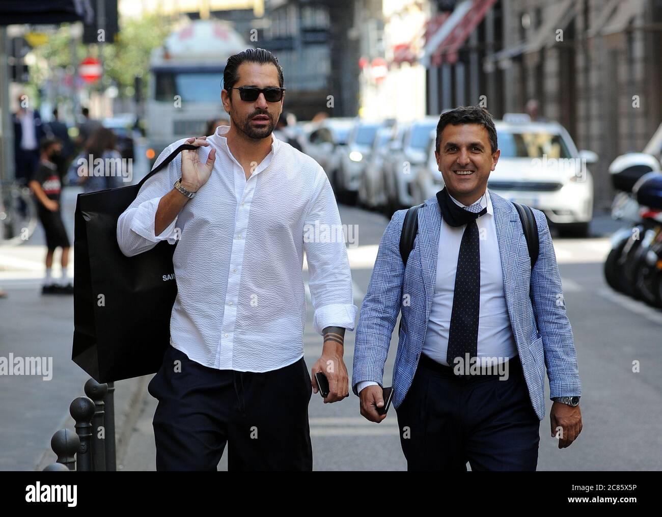 Milan, Marco Borriello shopping in the center Marco Borriello, recently  photographed together with Marica Pellegrinelli, ex-wife of Eros Ramazzotti,  arrives in the center for shopping. Enter the "SAINT LAURENT" boutique in  via