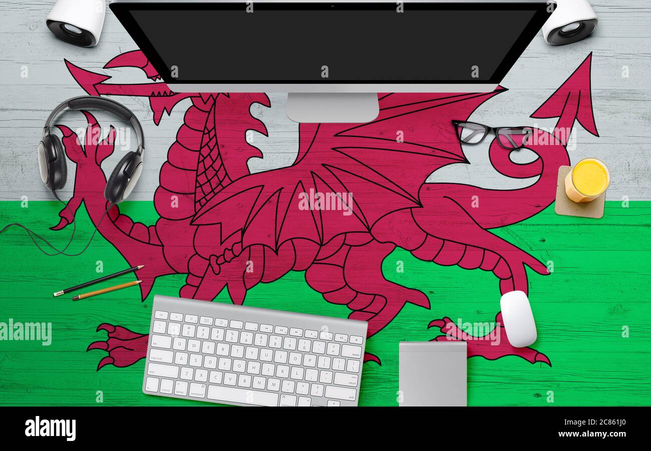 Wales Computer Wales flag background with headphone,computer keyboard and mouse on ...