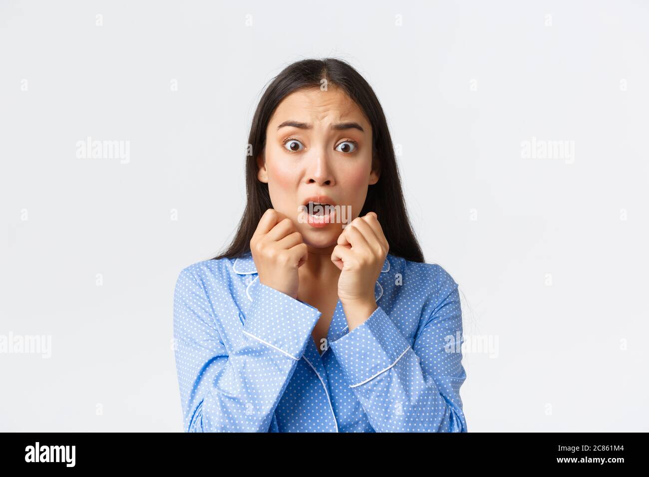 Close-up of scared asian woman in panic standing in pajama speechless,  react to frightening and shocking scene, looking afraid, shivering from fear  Stock Photo - Alamy