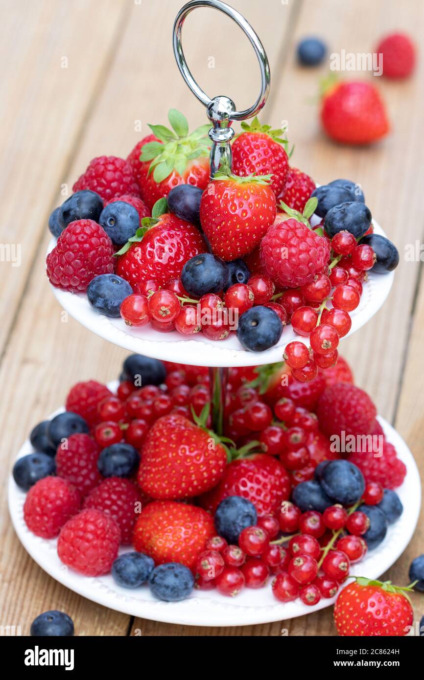 fresh mixed berries on tiered cake stand Stock Photo