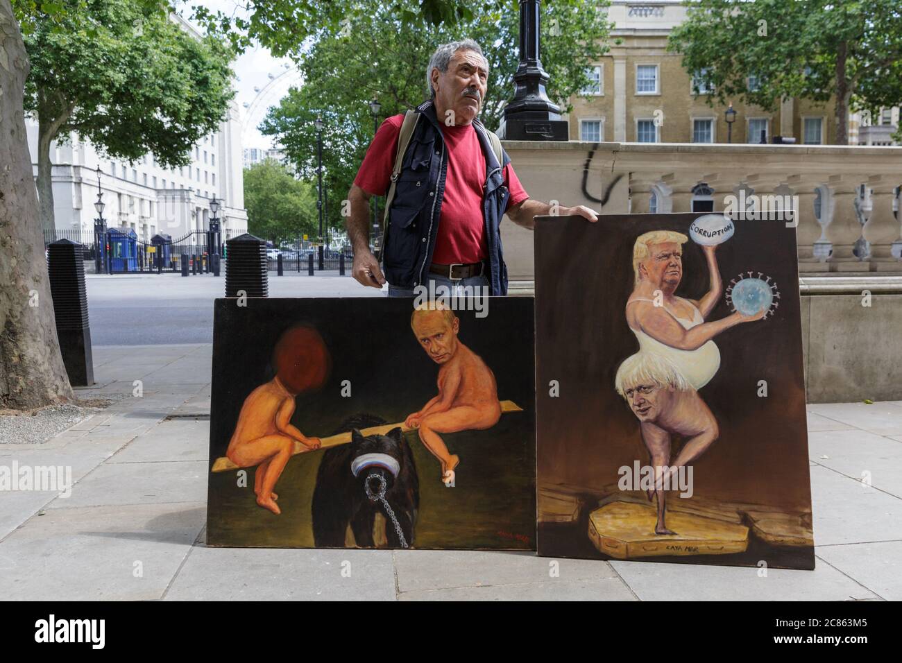 Westminster, London, UK. 21st July, 2020. Artist and political satirical painter Kaya Mar displays his take on today's release of the Russia Report and the US-British 'special relationship' in his paintings, outside Downing Street today. Credit: Imageplotter/Alamy Live News Stock Photo