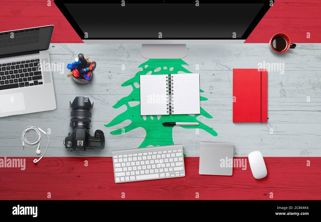 Lebanon flag background with headphone,camera, notebook and mouse on
