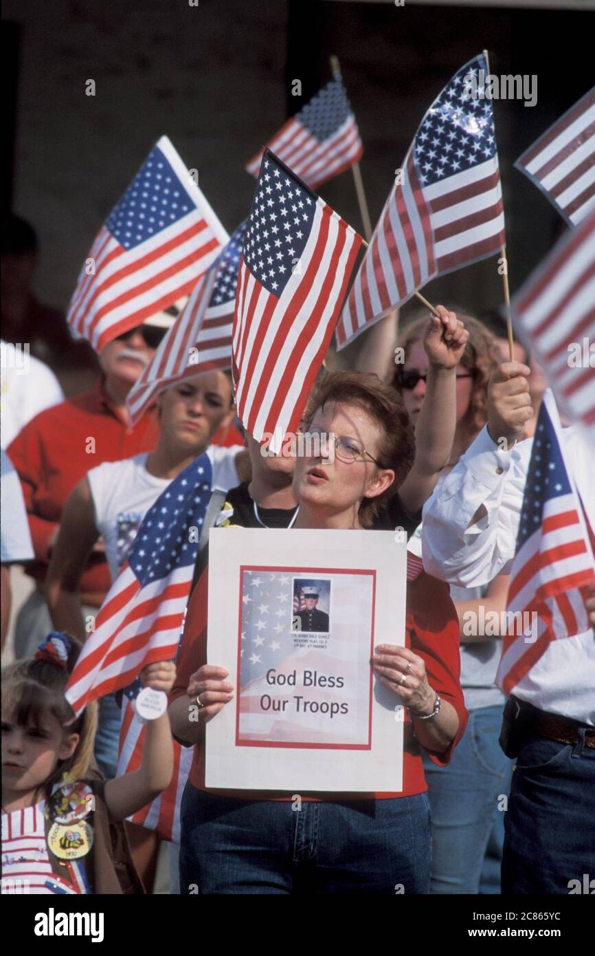 Georgetown, Texas USA, April 2003: American-flag-waving crowd  attends 'Support the Troops' rally in downtown during the war in Iraq. ©Bob Daemmrich Stock Photo
