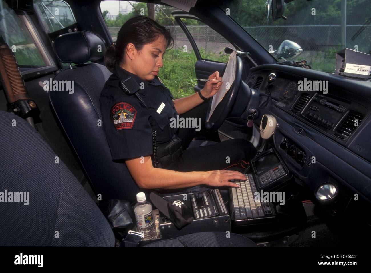 Female police officer on computer hi-res stock photography and images ...