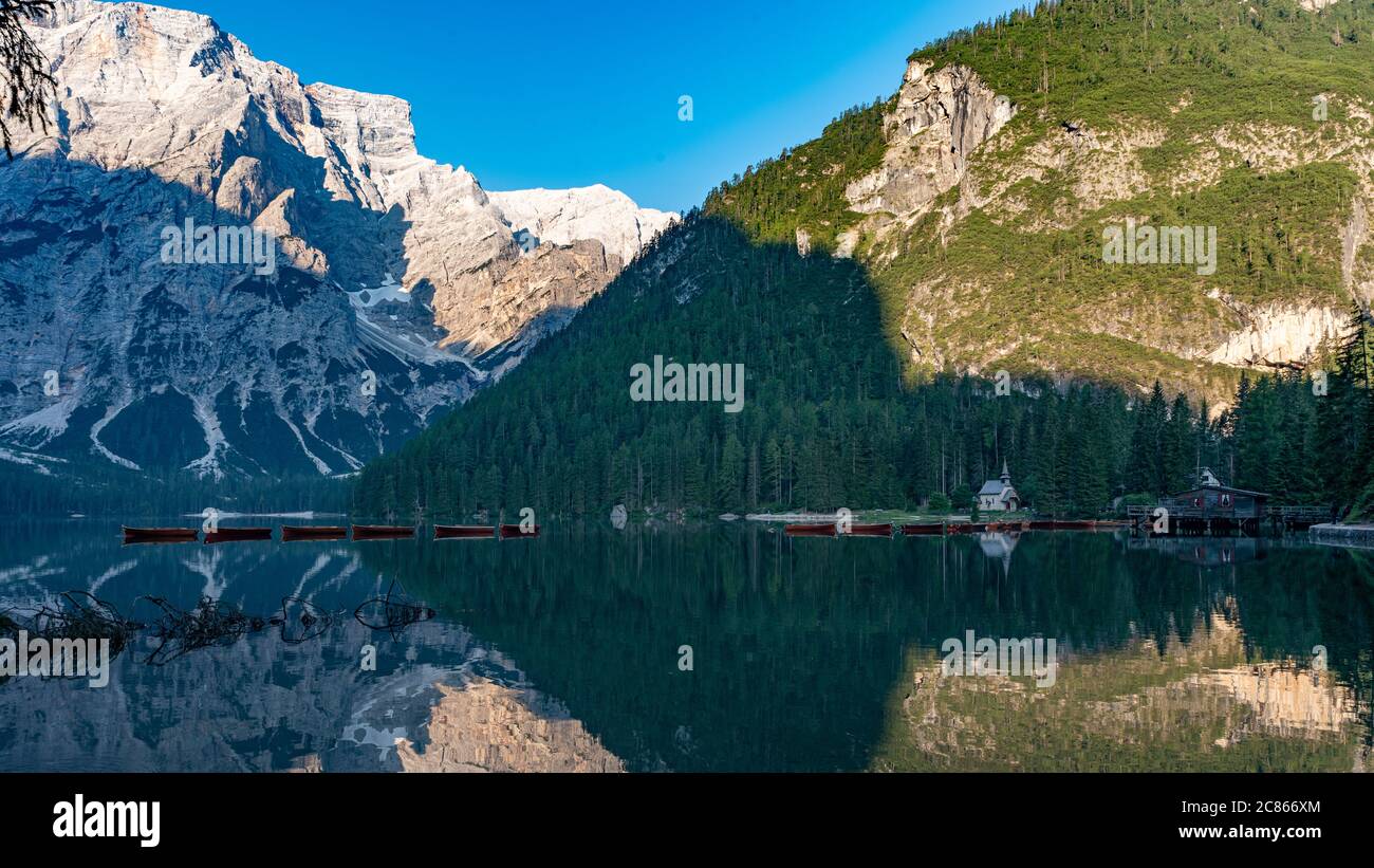 Mountain landscape with reflections on the Braies lake in Val Pusteria, South Tyrol Dolomites Stock Photo