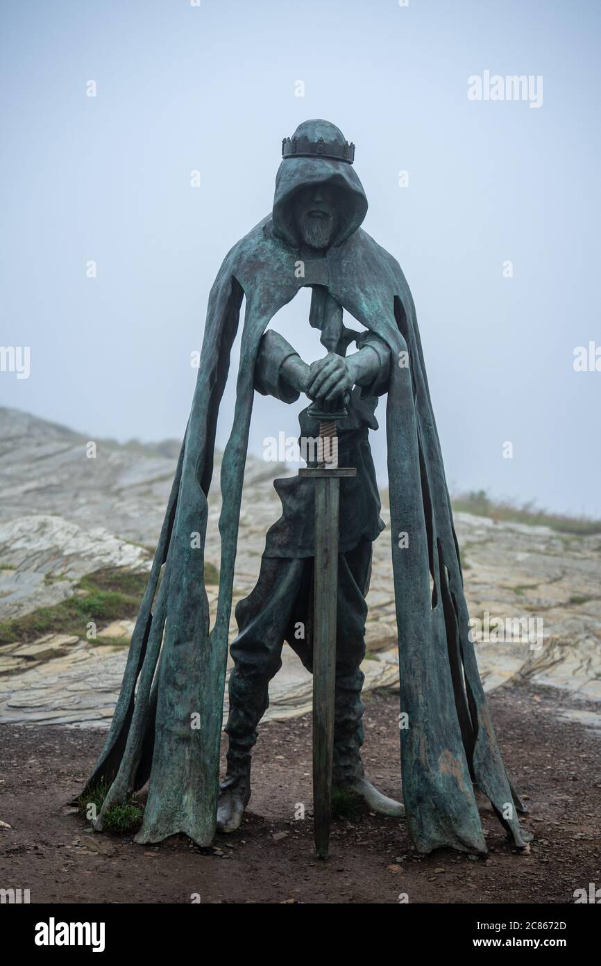 Bronze Sculpture of King Arthur Stands In Tintagel Castle Cornwall UK July 8 2020 Stock Photo