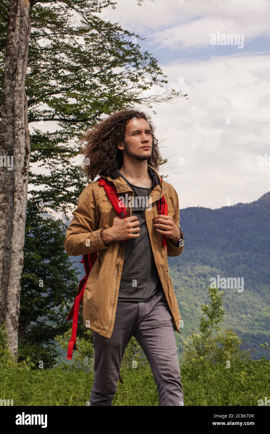 Curly haired man standing hi-res stock photography and images - Alamy