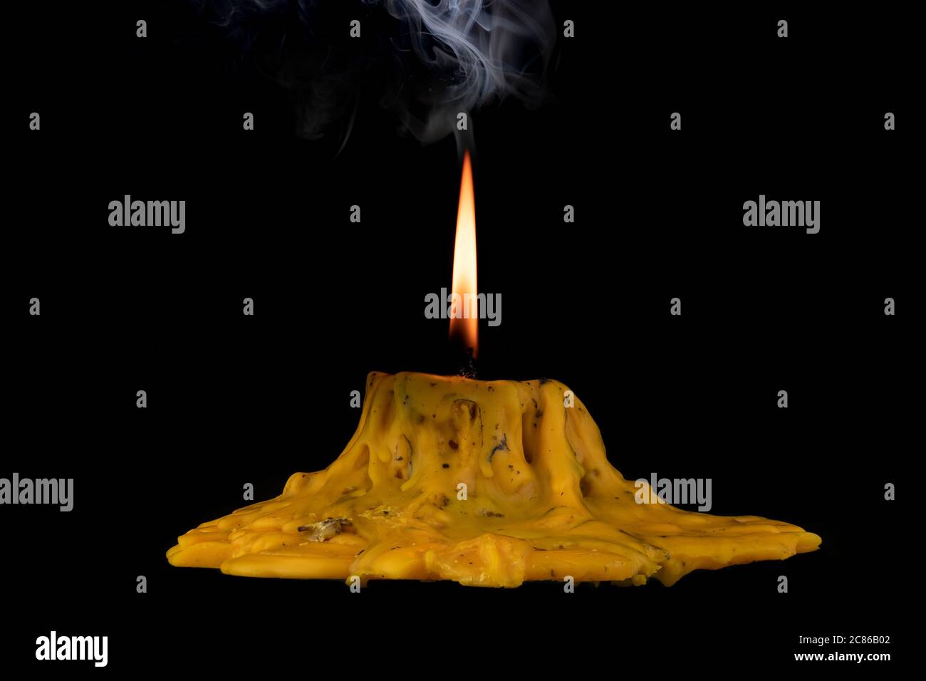 light flame candle burning brightly on black background Stock Photo
