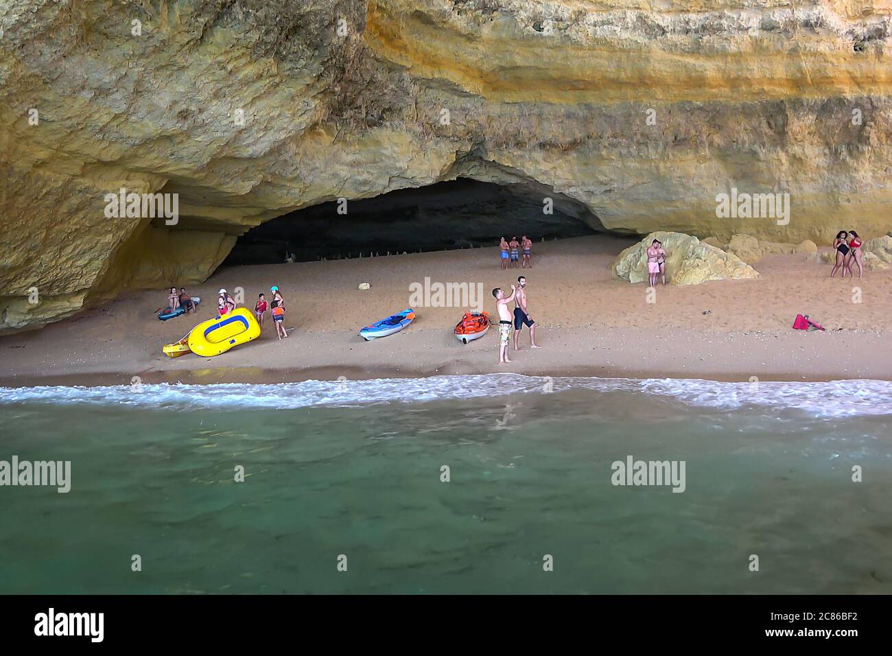 Lagoa, Portugal - July 11, 2020: View the famous Benagil Caves from the Sea Side. Beautiful Natural Sea Cave with emerald water Stock Photo