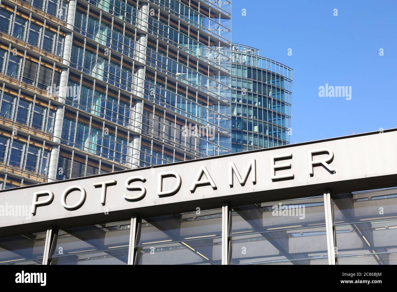 Modern office buildings in Potsdamer Platz in central Berlin. In front of them the underground entrance. Stock Photo