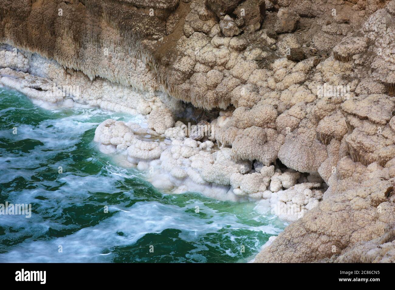 Salt concretions on the shore of the Dead Sea in Jordan Stock Photo