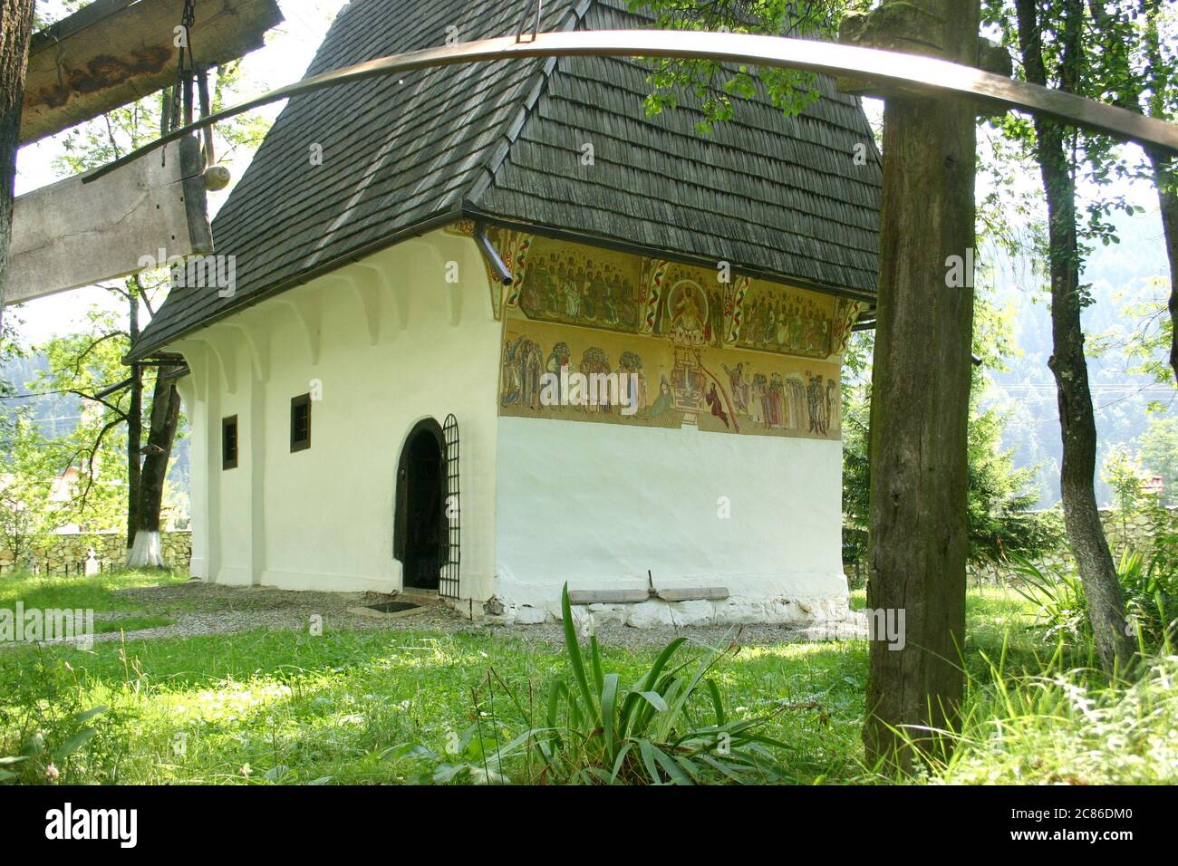 The15th century Orthodox church at Lupsa Monastery in Alba County, Romania. A wooden and a metallic semantron in the foreground. Stock Photo