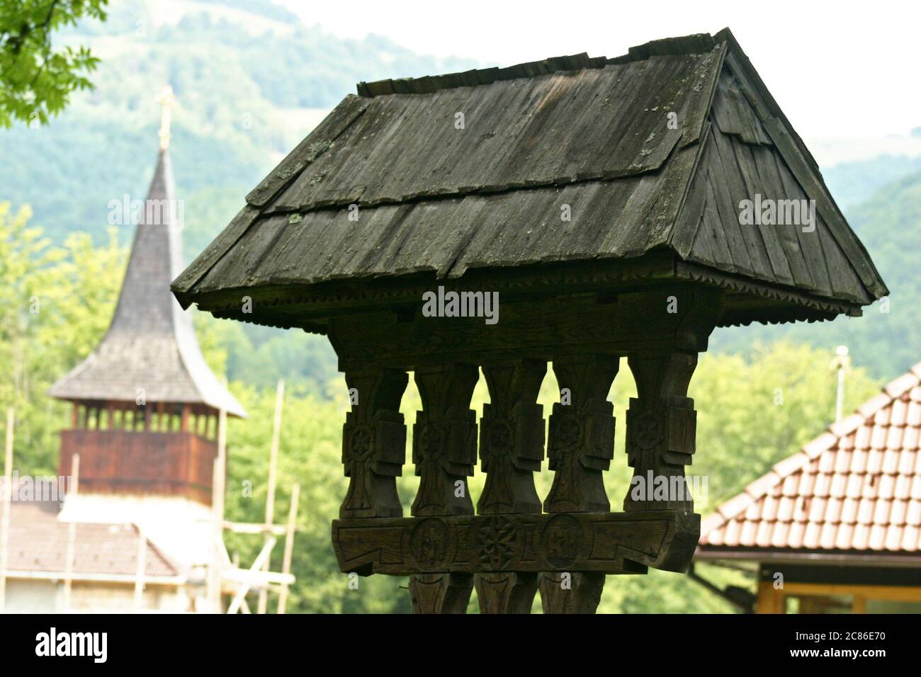 Carved wooden crucifix at a monastery in Romania Stock Photo