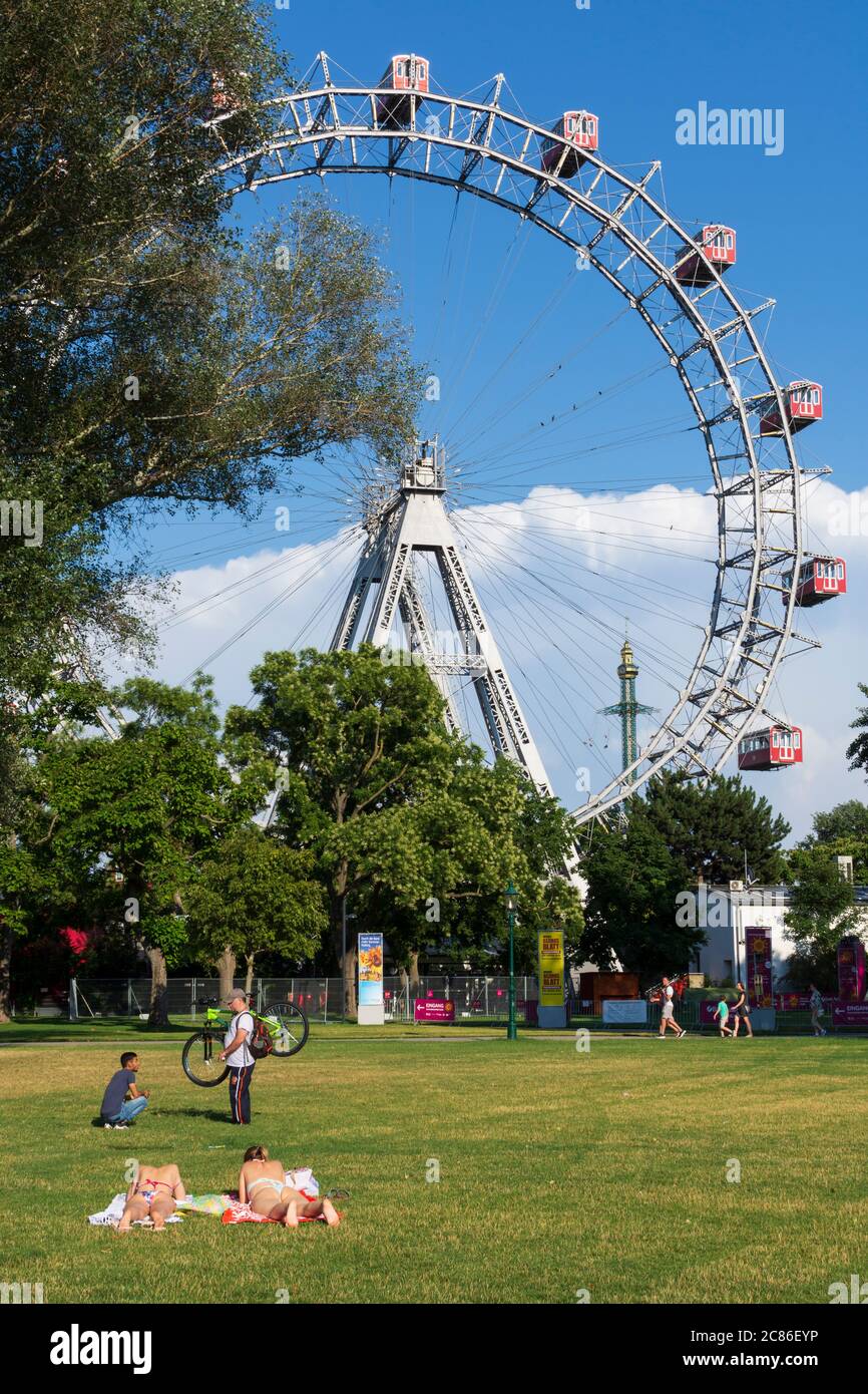 Wien, Vienna: Ferris Wheel in Prater, sunbathing girls, carousel Praterturm  type Highflyer in 02. Leopoldstadt, Wien, Austria Stock Photo - Alamy