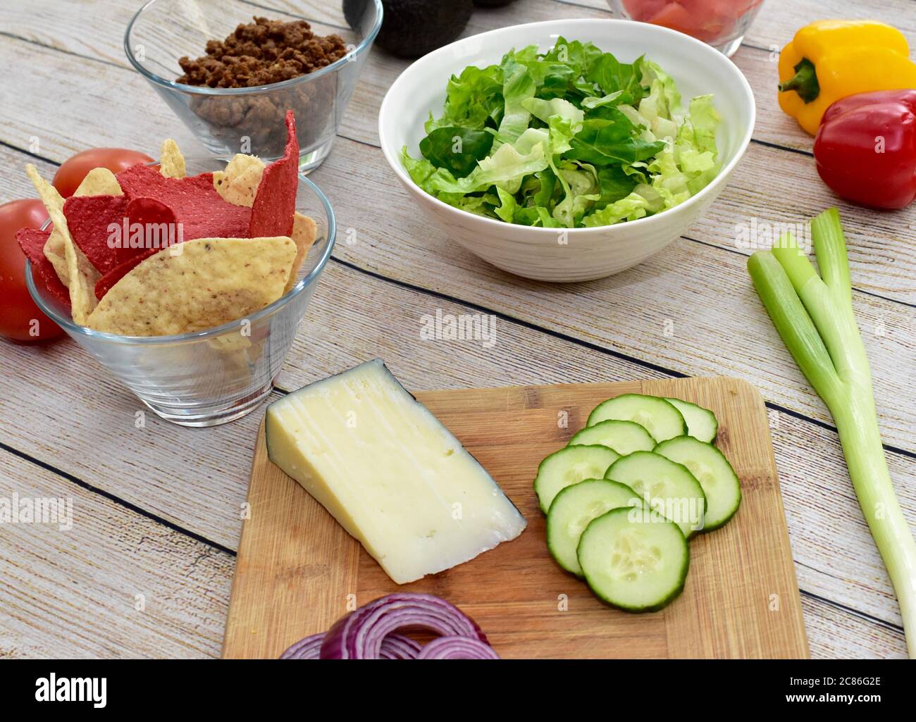 Healthy wholesome ingredients set out ready to prepare meal kit family dinner of gourmet taco salad with fresh harvested vegetables Stock Photo